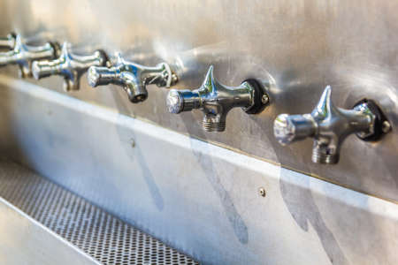 Stainless steel faucet of water cooler, Selective focus
