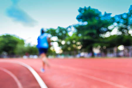 A Blur photo of athletic and running track use for as backgroundの写真素材