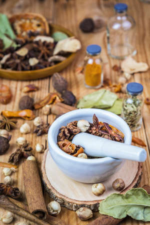 A photo of Mortar Grinder Herb and herbal medicine on white background, Selective focus, Soft focusの写真素材