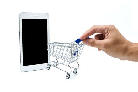 A photo of hand and shopping cart Which headed to the tablet, That's look like entering the online market.の写真素材