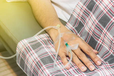 A photo of Patient arm with Saline needleの写真素材