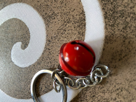 A closeup shot of a ring with a red ball on topの写真素材