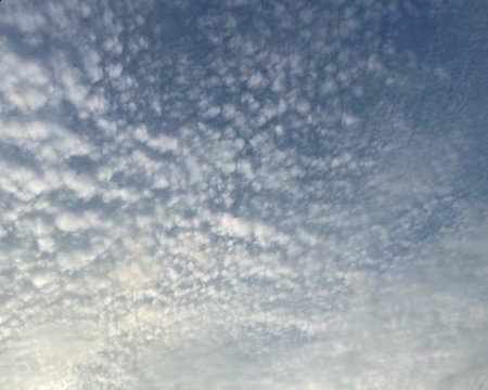 Clouds in the blue sky as a background for multiple projects.の写真素材