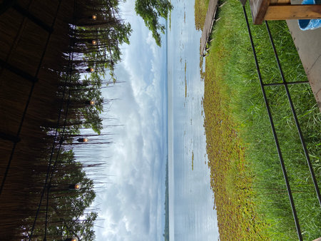 Reflection in the water of the roof of the house, Thailand.の写真素材