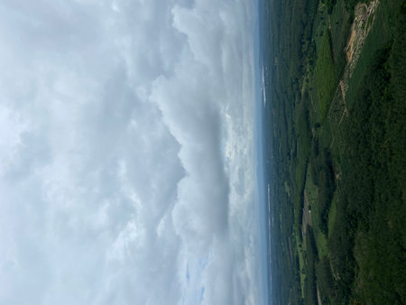 Aerial view of the road in the mountains. Cloudy sky.の写真素材