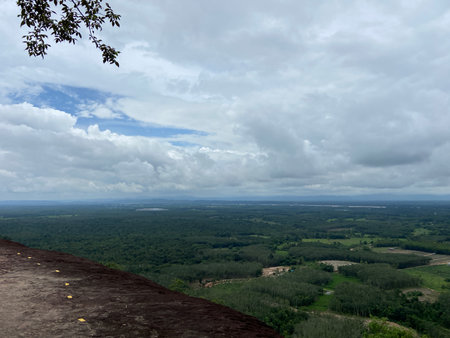 View from the top of the mountain to the valley and the sky with cloudsの写真素材