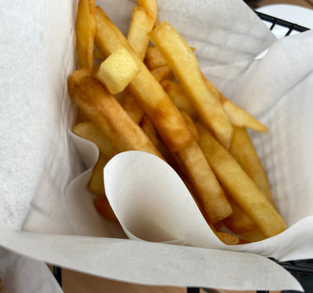 French fries in a basket, close-up, selective focus.の写真素材
