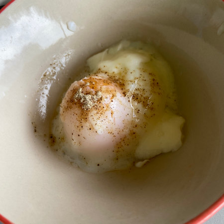 Boiled egg in a bowl on a white background. Top view.の写真素材