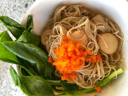 Noodles in white bowl on the table