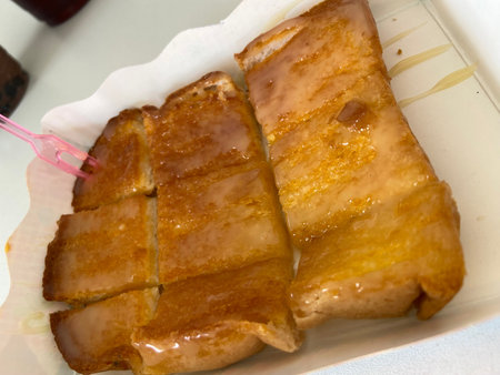 Grilled pork belly with sweet and sour sauce in white plate.の写真素材