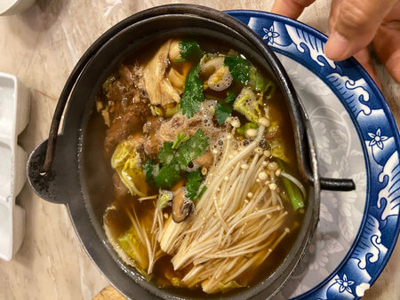 Bowl of asian noodle soup with beef and vegetables.