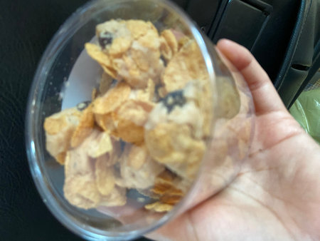 Cornflakes in a glass bowl. Selective focus and shallow depth of field.