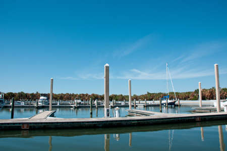 the docks of the marina against blue skiesの写真素材