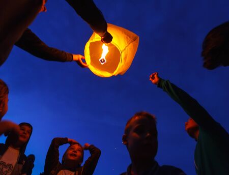 Children are seen launching a paper lantern during the manifestations on the International Children's Day, in Galati, Romania, June 1, 2013.のeditorial素材