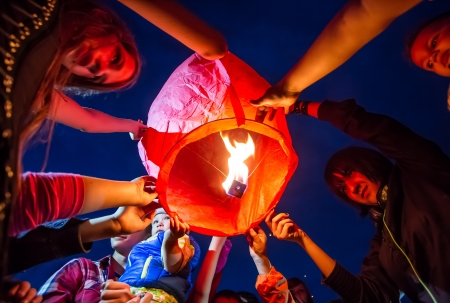 Children are seen launching a paper lantern during the manifestations on the International Children's Day, in Galati, Romania, June 1, 2013.のeditorial素材
