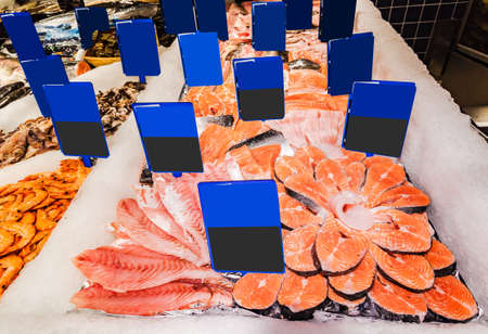 Fresh seafood on ice at the fish marketの写真素材