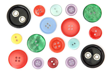 Set of different and colored sewing buttons, cut out and isolated on white backgroundの写真素材