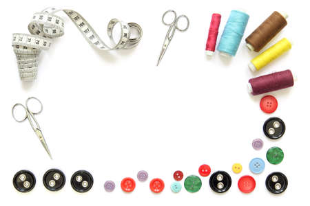composition with colorful sewing tools and accessories cut-out and isolated in white frame with...