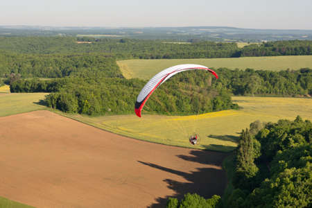 The Yonne department seen from the sky by paramotor over fields, Bourgogne region, Franceのeditorial素材