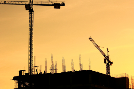 Construction site with crane on sunset background  の写真素材