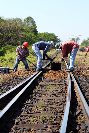 worker repairing change railway sleepers  in rural thailandのeditorial素材