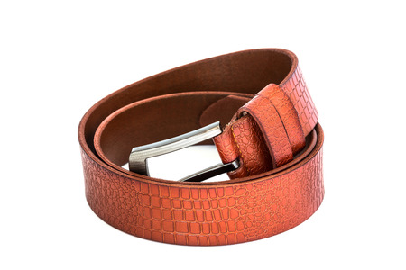 brown leather belt on white backgroundの写真素材