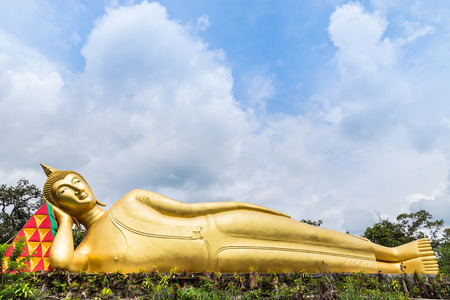 big golden buddha statue reclining in thai templeの写真素材