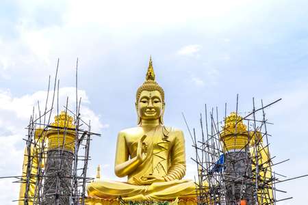 big  golden buddha statue under construction  in thai  templeの写真素材