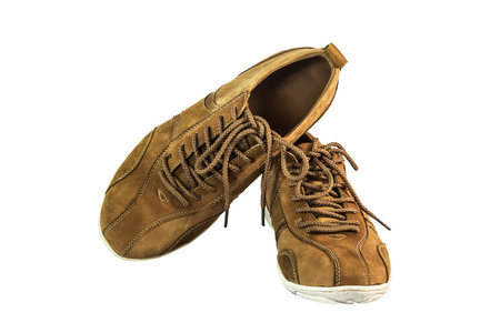 brown suede leather shoes on black white background