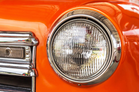 Close up front headlights lamp of vintage carの写真素材