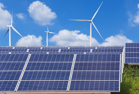 solar photovoltaics  panel and wind turbines generating electricity in solar power station
