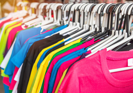 close up different colors  T- shirt on hangers selective focus