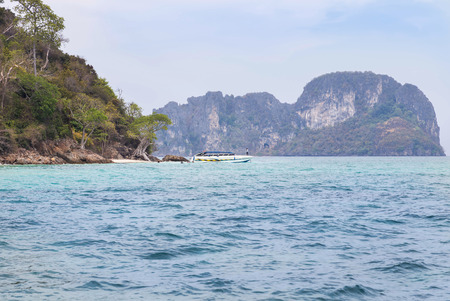 tourist boat moored in andaman tropical sea during tourists divingのeditorial素材