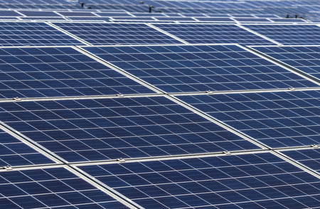 Close up rows array of polycrystalline silicon solar cells or photovoltaics in solar power plant...