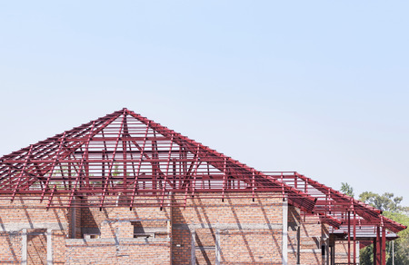Steel roof frame structures in residential construction site