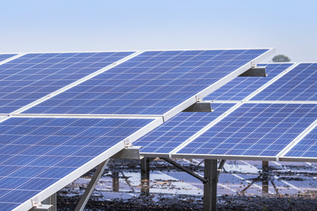 Close up rows array of polycrystalline silicon solar cells or photovoltaics in solar power plant...