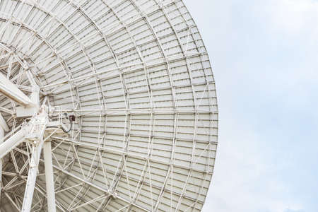 back side view of a big white satellite dish