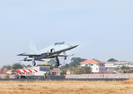 Fighter jet military aircraft flying with high speed take off  from runway with steam from exhaustのeditorial素材