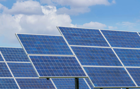 Close up rows array of Solar panels or solar cells or photovoltaics in solar power station , clean energy power sustainable energy environmentally friendlyの写真素材