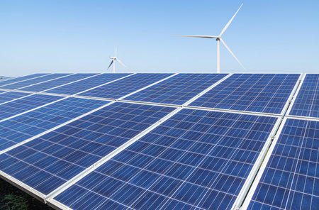 Solar panels with wind turbines generating electricity in hybrid power plant systems station , clean energy power sustainable  energy environmentally friendlyの写真素材