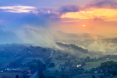 High angle landscape view above country road cover with the fog from Khao Takhian Ngo view point while sunrise in morning at Khao Kho, Phetchabun  Thailand.の写真素材