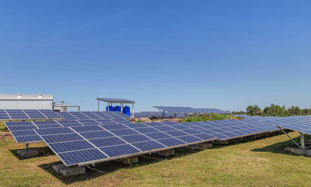 Close up rows array of polycrystalline silicon solar panels or photovoltaic cells in solar power plant alternative clean energy  environmentally friendly 
on blue skyの写真素材