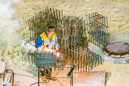 Fragment of the work of the welder at the construction site.