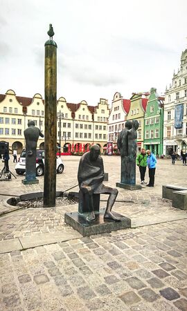 Rostock, Germany - September 23, 2018: Sculpture and beautiful buildings.