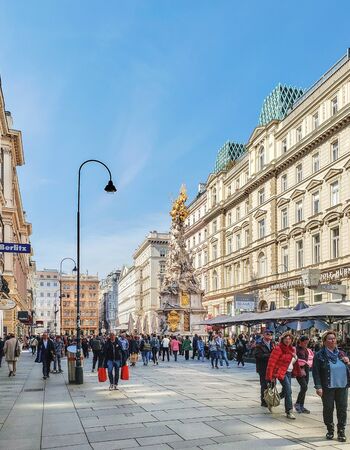 VIENNA, AUSTRIA - April 2, 2019: Graben Street is a famous pedestrian area that departs from Stefansplatz square. Plague Column erected in 1682?92.のeditorial素材