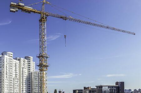 A fragment of the city of Kiev, Ukraine. In the foreground is a tower crane over one of the new...