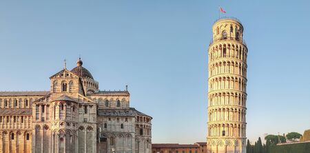 View of the cathedral and the bell tower (Leaning Tower of Pisa) in the city of Pisa, Italy.