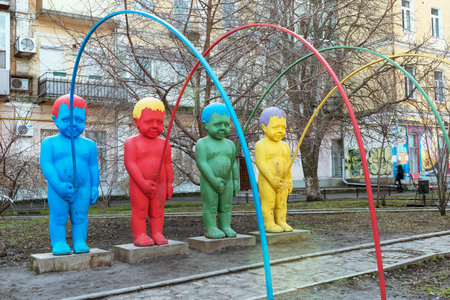 Kiev, Ukraine - March 07, 2014: Boys Pis funny sculpture group at Landscape alley, the famous children's park. Colorful and creative installation.のeditorial素材
