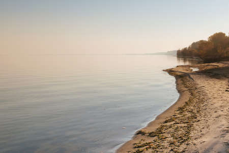 Beautiful autumn sunset on the banks of the Dnieper river.