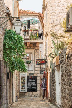 Budva, Montenegro - August 28, 2017: Old Town Street Budva, Montenegro. The first mention of this city - more than 25 centuries ago. We see ancient houses, a very narrow street, cafes, shops.のeditorial素材